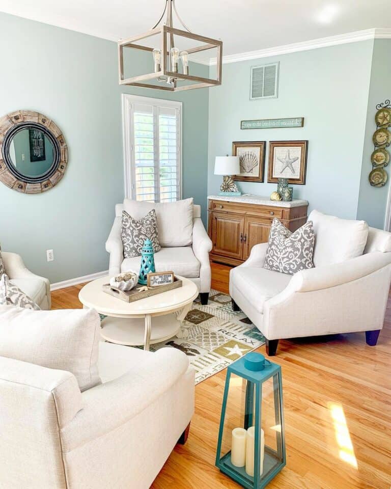 Teal Walls With Plush White Lounge Chairs