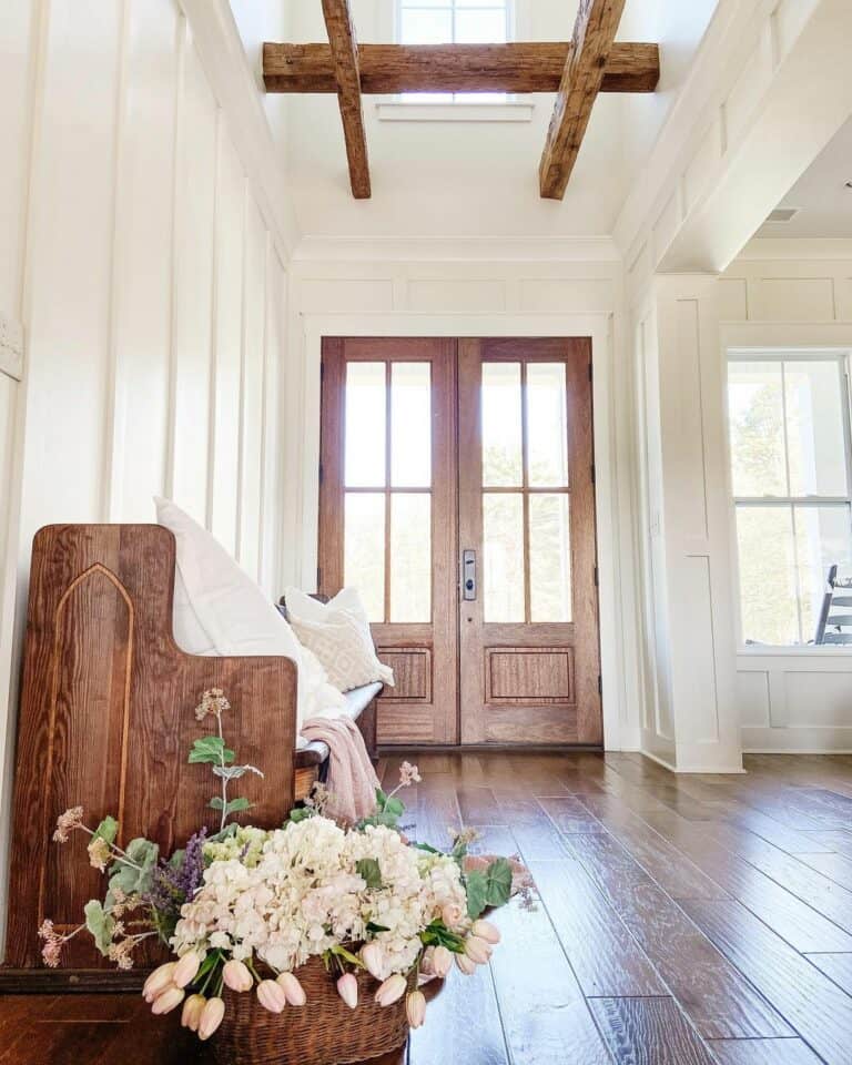 Two-story Foyer With Stained Wood Bench
