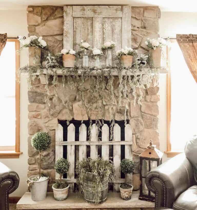Uneven Stone Fireplace With Greenery Décor for Summer