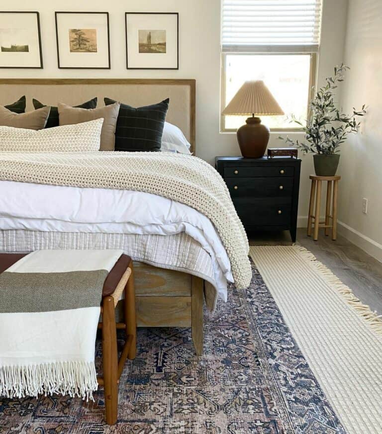 Vintage Artwork Above Reclaimed Wood Bed