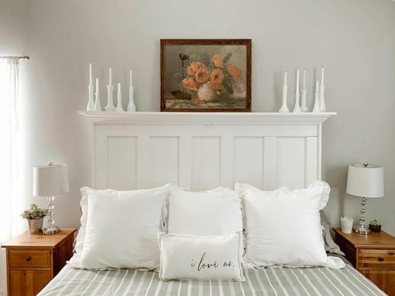 Vintage Floral Artwork in Pristine White Bedroom