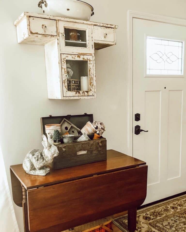 Vintage Wall Cabinet and Toolbox as Foyer Decorations