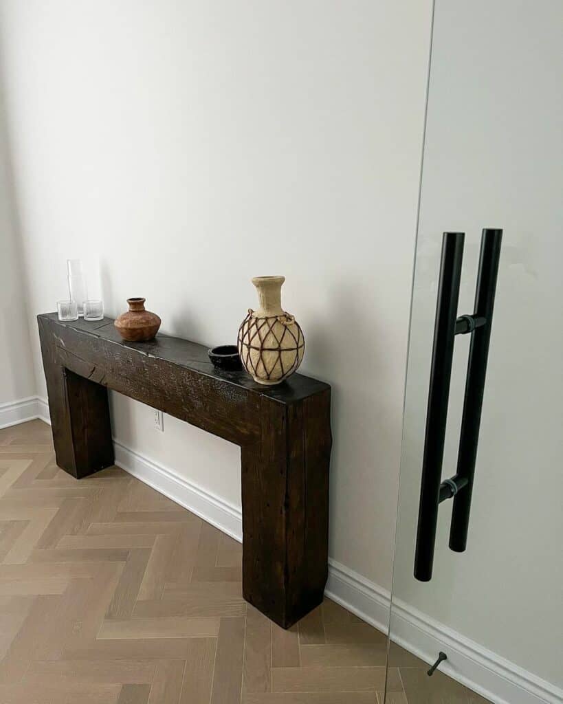 Vinyl Plank Herringbone Flooring Hosts a Console