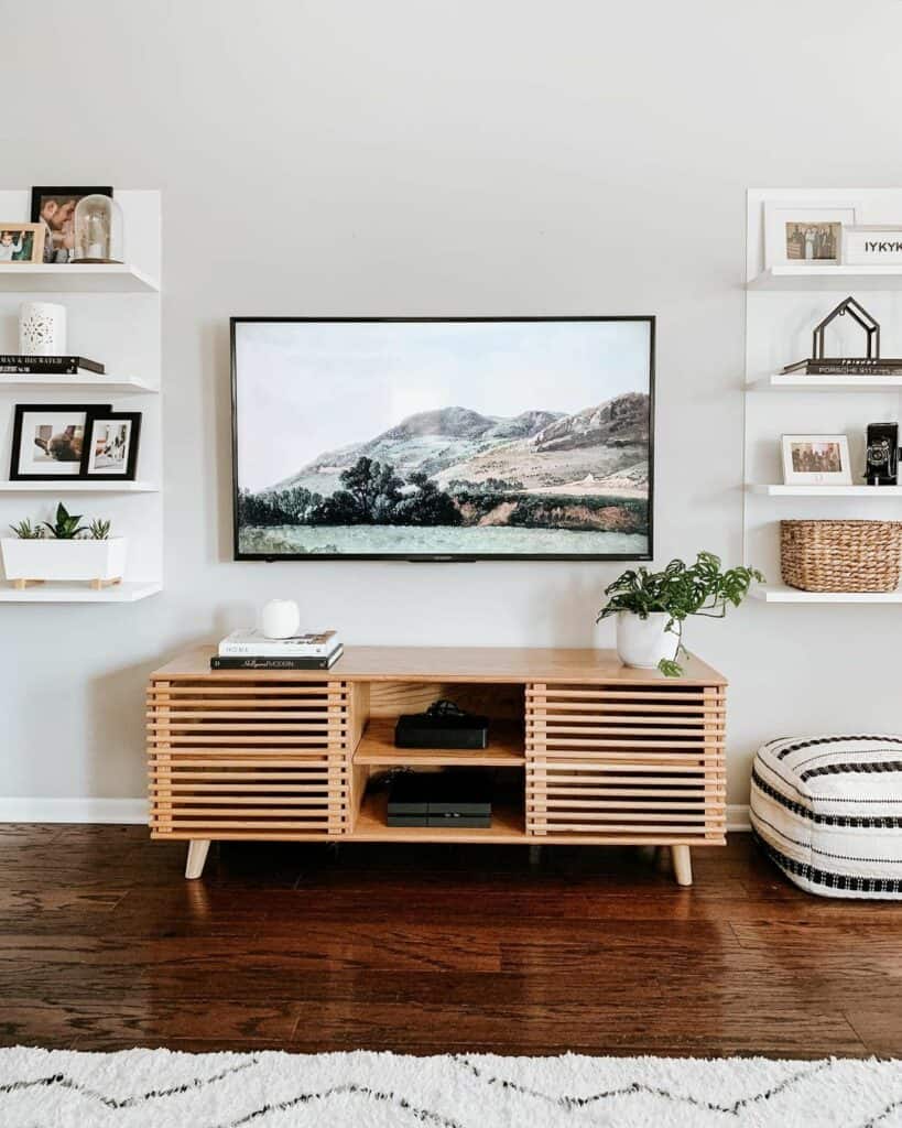 Wall-mounted TV Flanked With White Floating Shelving