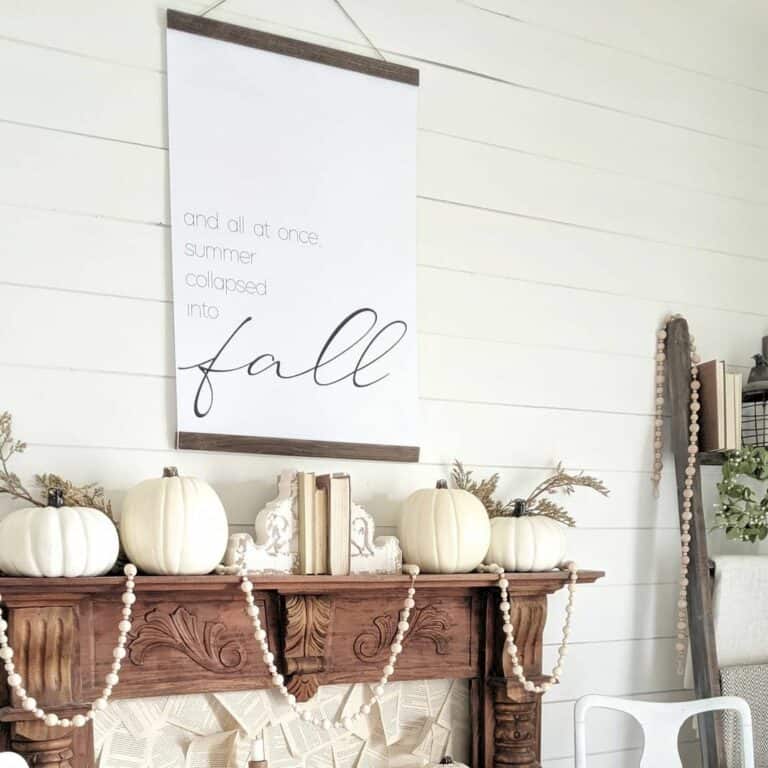 Warm Wood Mantel With White Fall Décor