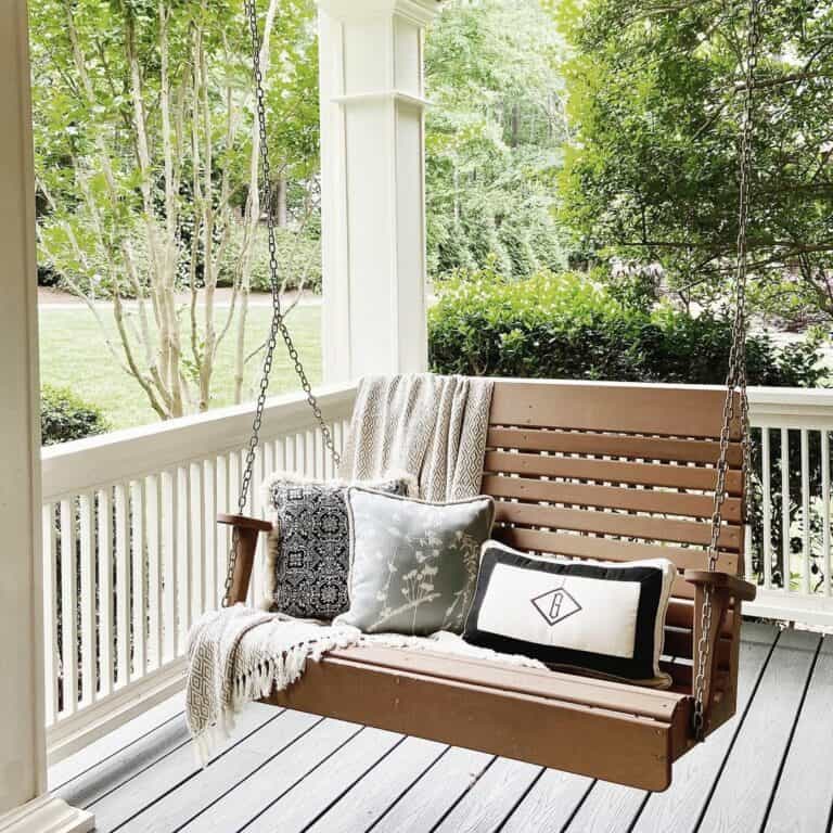 Wellington-style Columns With Brown Porch Swing
