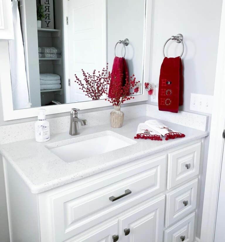 White Bathroom With Speckled Countertop