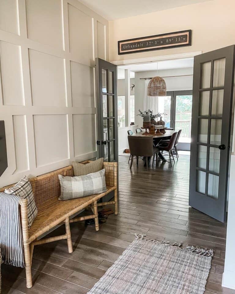 White Board and Batten Entryway With Rattan Bench