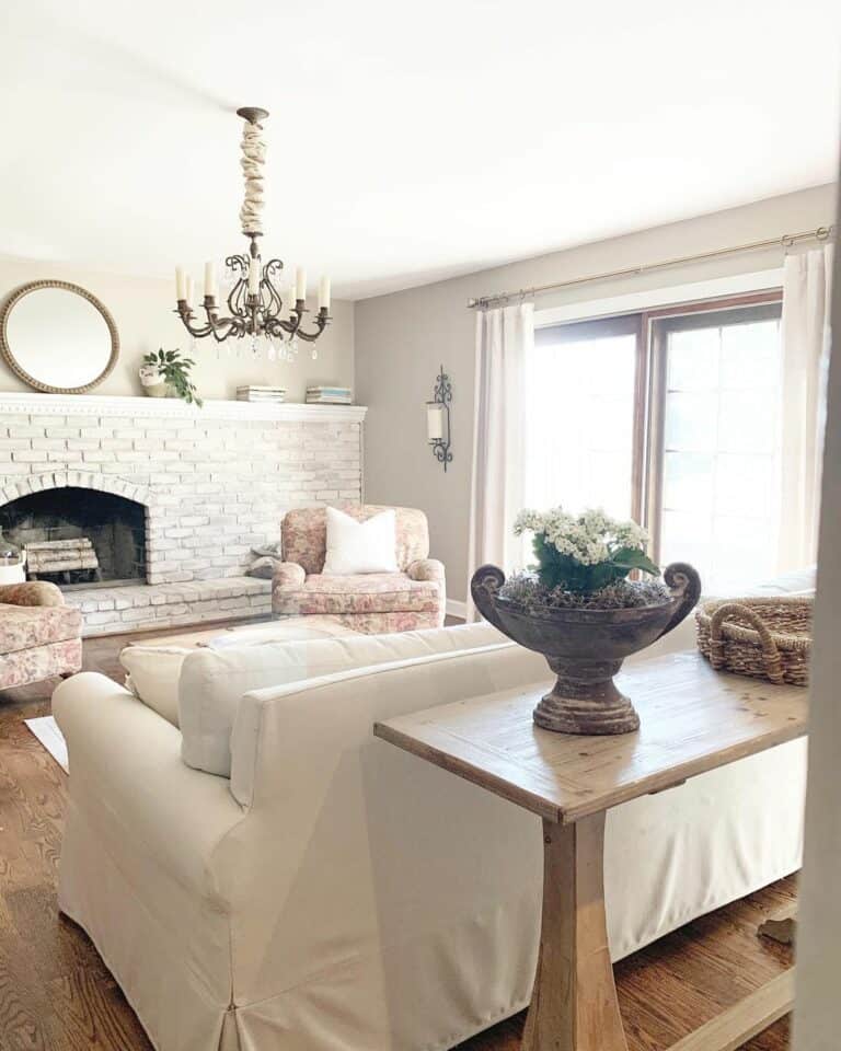 White Brick Fireplace Extends Across One Wall