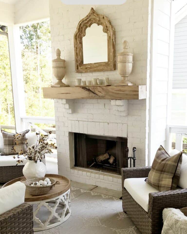 White Brick Fireplace With Wood Mantel