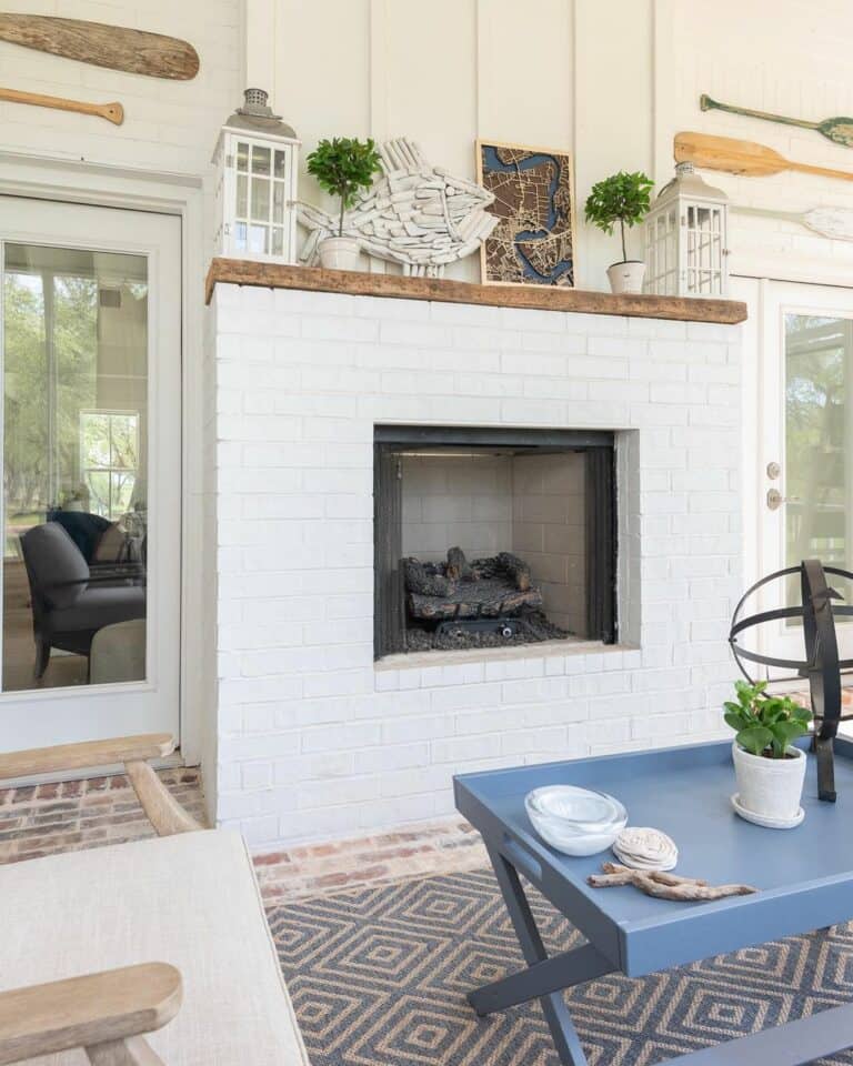White Brick Outdoor Fireplace With Cottage Accents