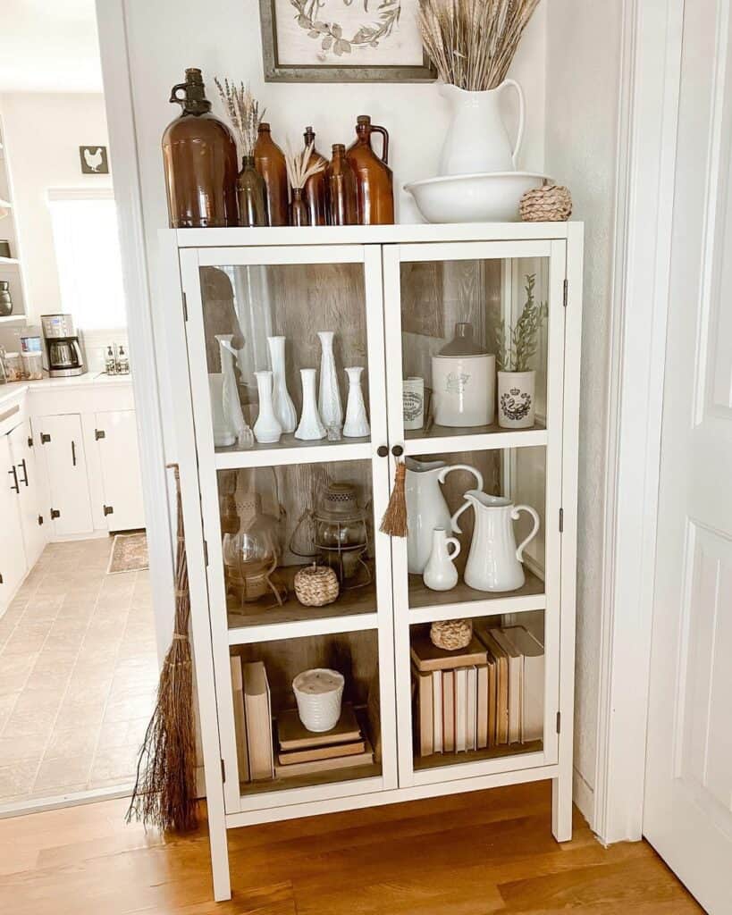White Cabinet With Books and Crockery