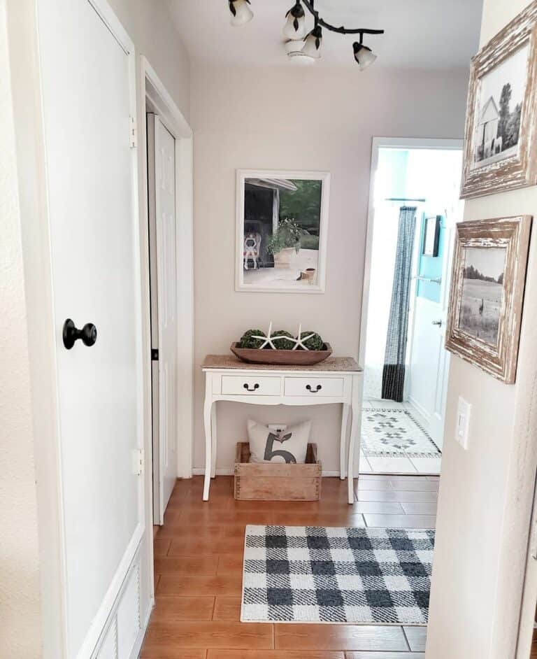 White Console Table Beside Plaid Mat