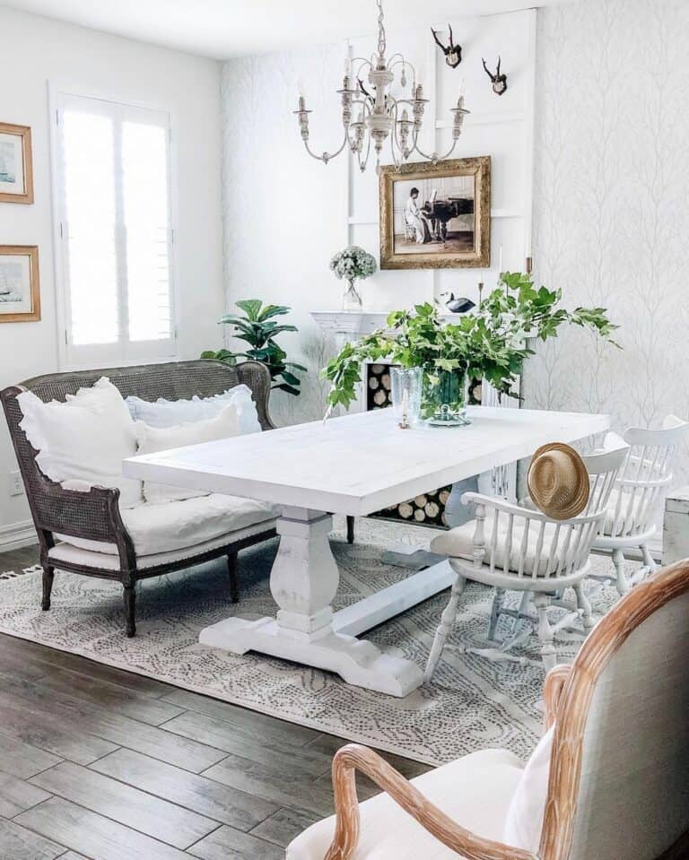 White Dining Room With Bench and Chandelier
