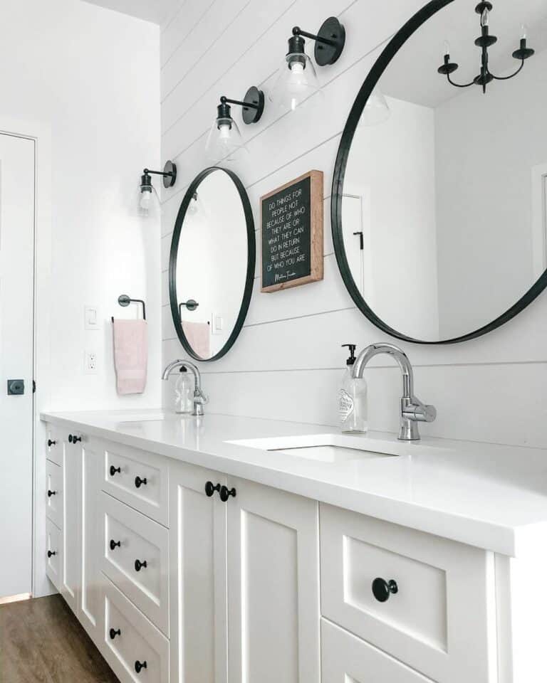 White Farmhouse Bathroom With Black Knobs