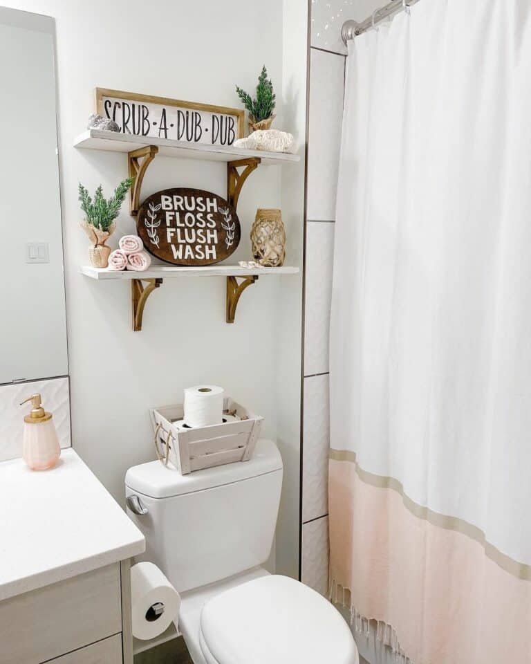 White Farmhouse Bathroom With Pink and Gold Accents