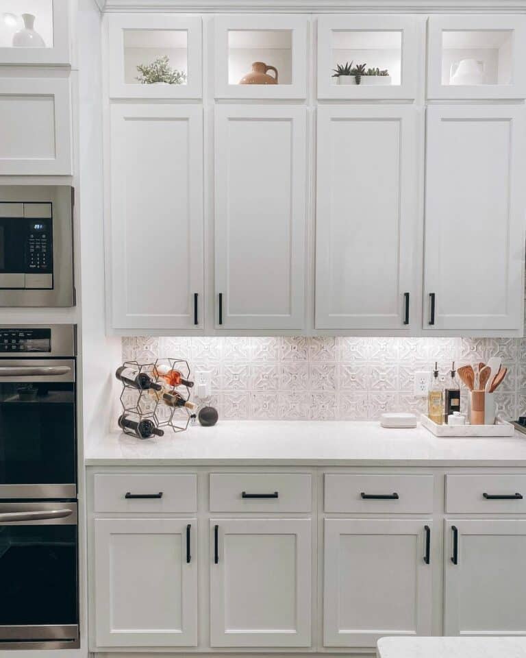 White Farmhouse Kitchen With Illuminated Shelf Display