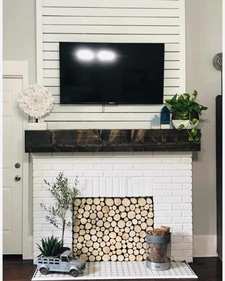 White Fireplace With Dark Wood Mantel Stacked Wood