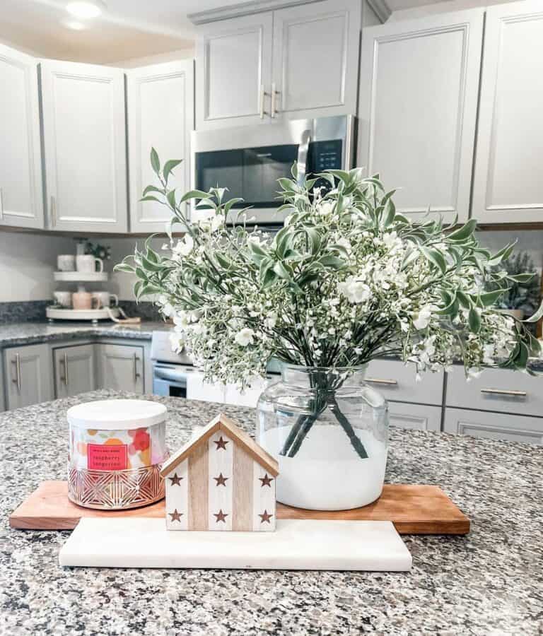White Flowers and a House With Gold Stars
