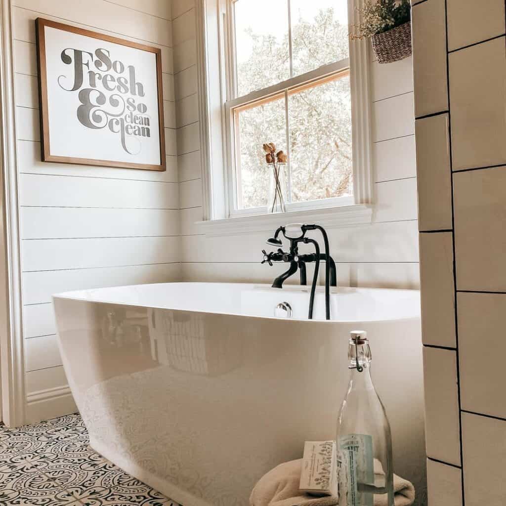 White Freestanding Bathtub With Black Faucet Soul & Lane