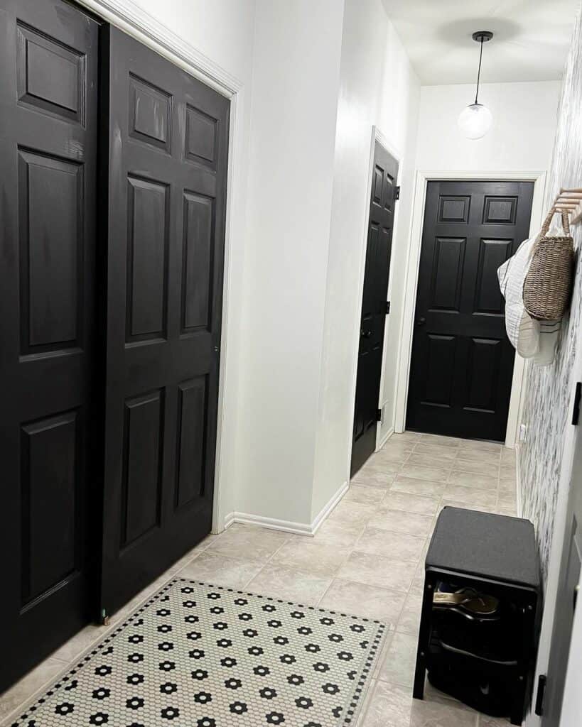White Hallway With Black Doors and Trim