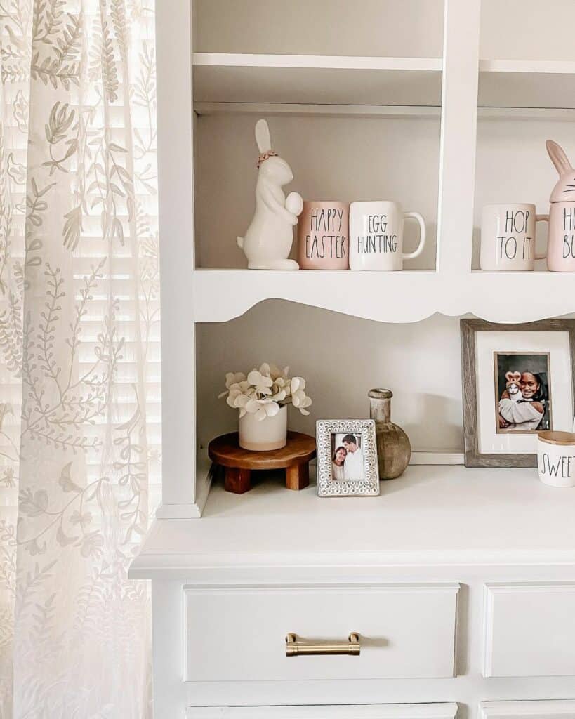 White Hutch With White and Pink Easter Decorations