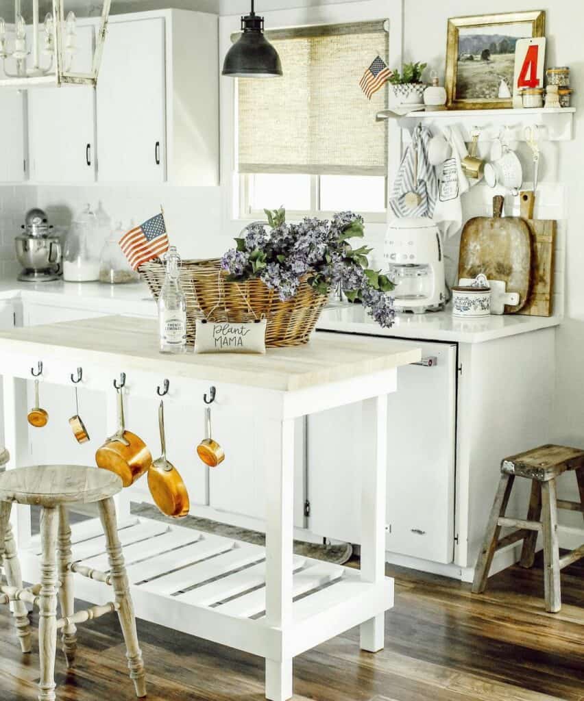 White Kitchen Island With Copper Pans