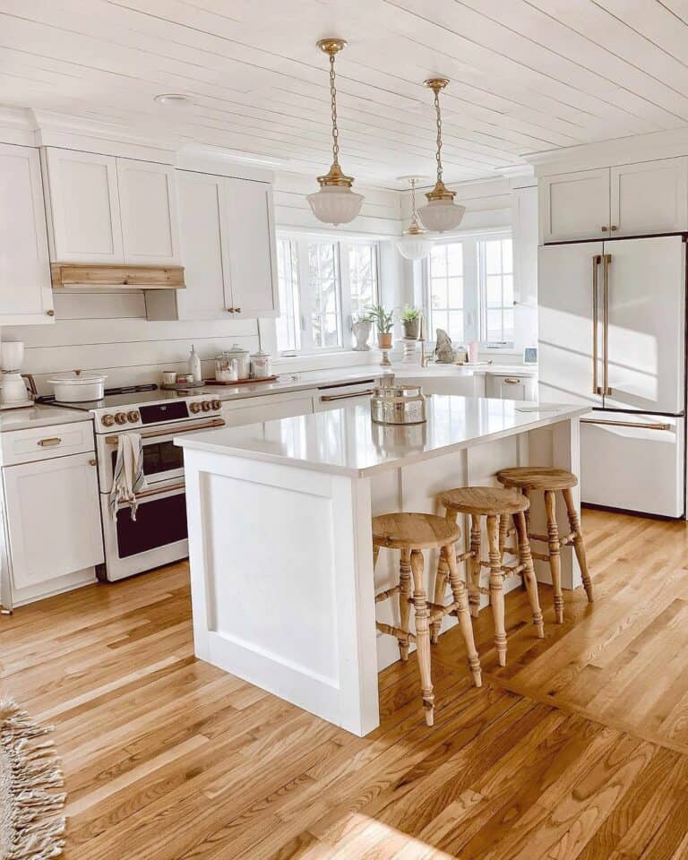 White Kitchen Island With Gold Fixtures