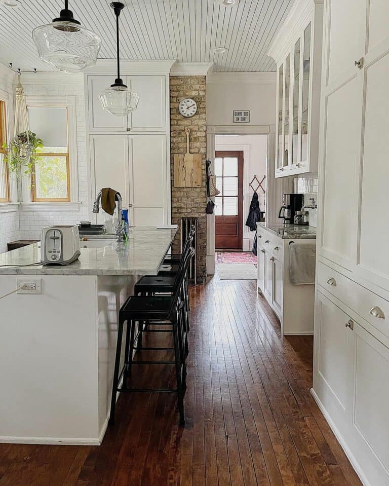 White Kitchen With Brick Accent Wall