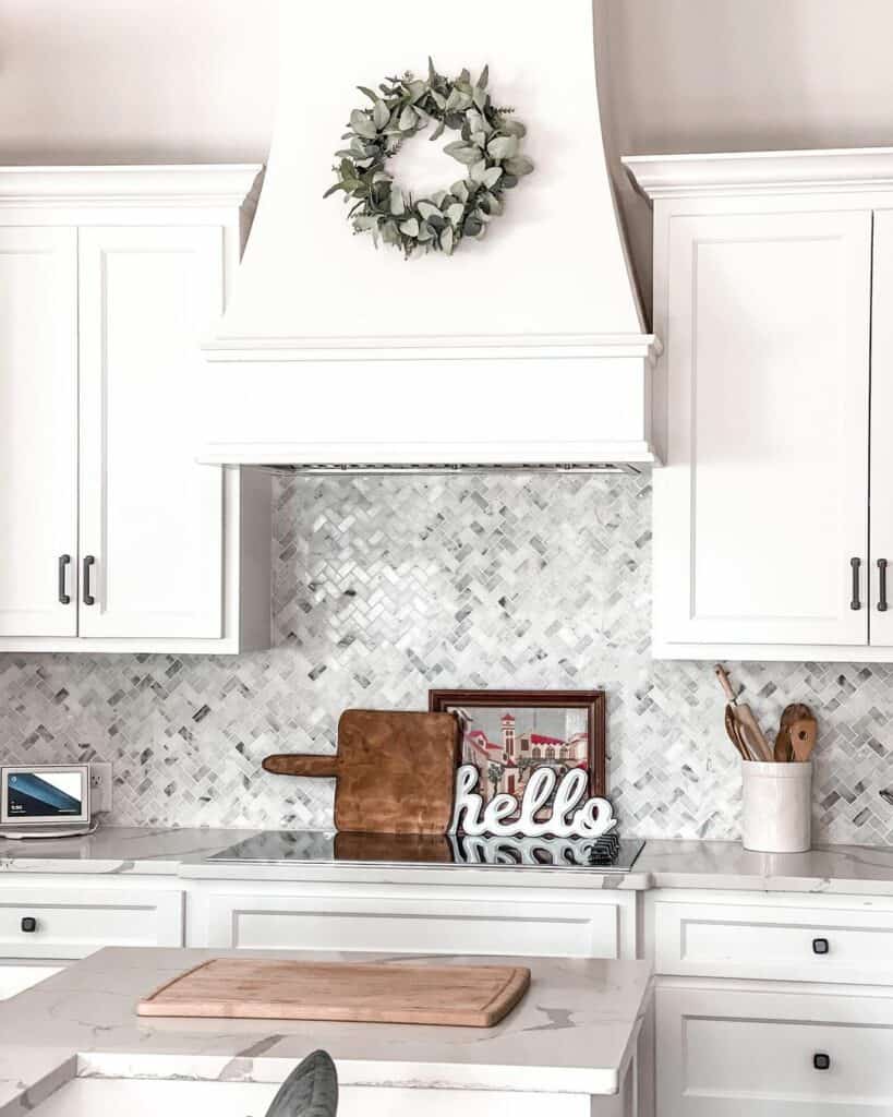 White Kitchen With Contrasting Herringbone Backsplash