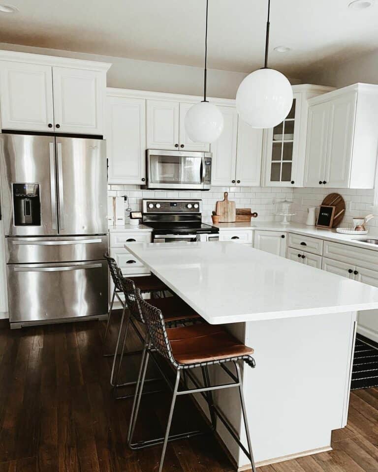 White Kitchen With Stainless Steel Appliances