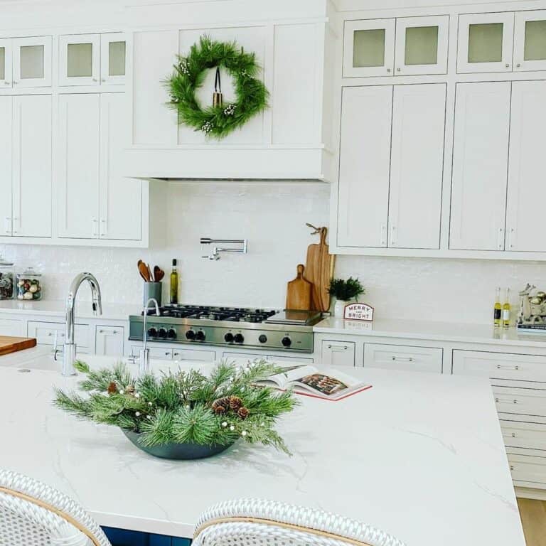 White Kitchen with Greenery Accents