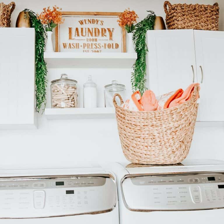 White Laundry Room With Seagrass Baskets