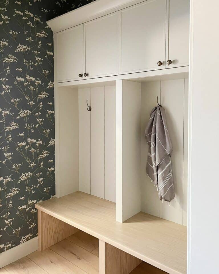 White Mudroom Built in Storage With a Bench and Accent Wall