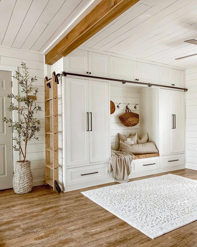White Mudroom Cabinets With Rolling Wood Ladder