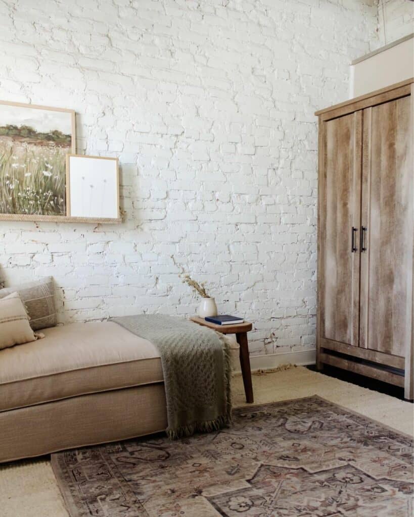 White Painted Brick Wall With Wood Frame Artwork