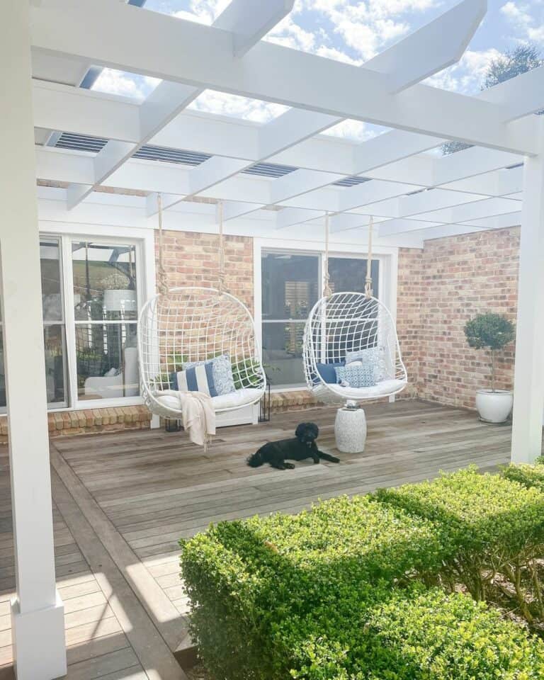 White Pergola With White Hanging Egg Chairs Soul & Lane