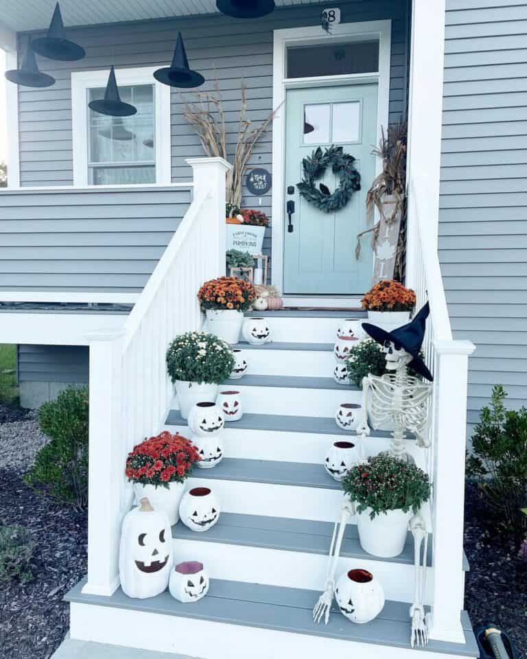 White Porch Handrails With Fall Décor