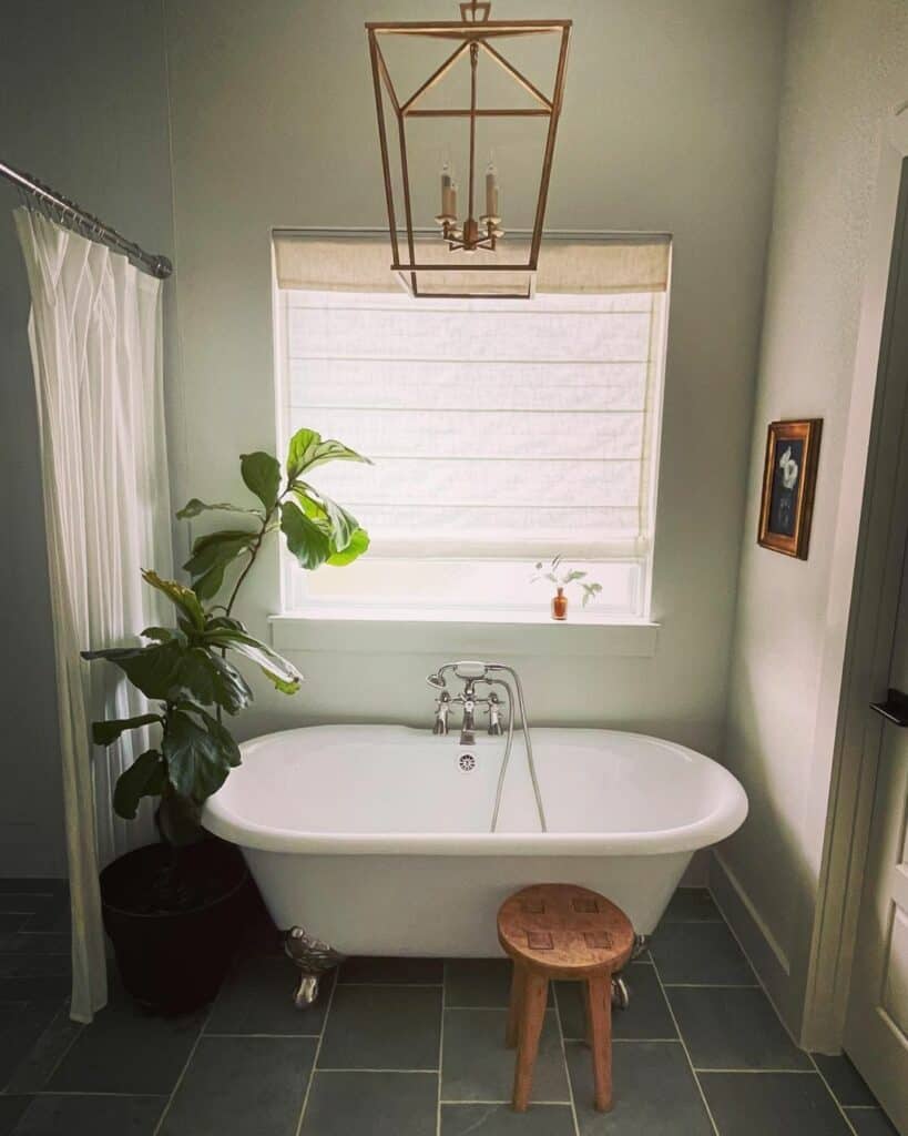 White Roman Shade on Gray Tile Bathroom Floor