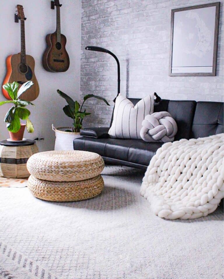 White Rug With Black and Wicker Accessories