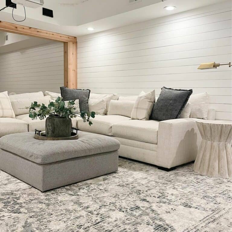 White Shiplap Basement With Off-white Sectional