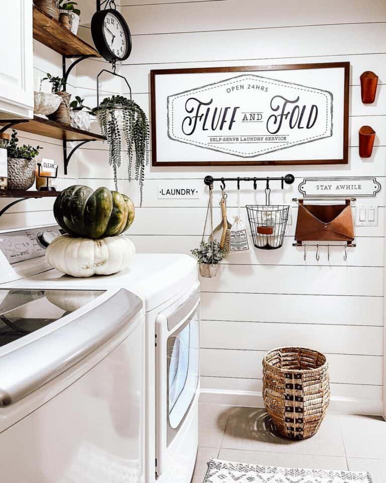White Shiplap Laundry Room With Round Woven Basket