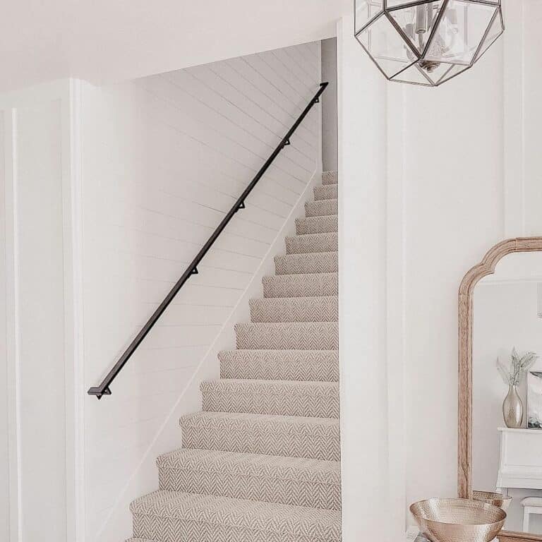 White Shiplap Walls and a Beige Herringbone Carpet