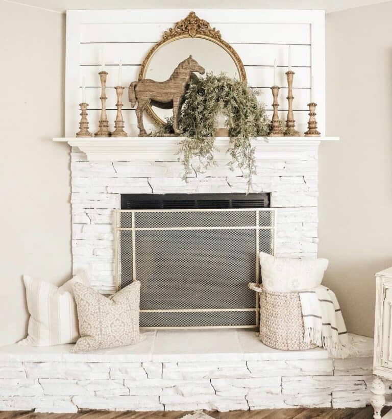 White Stone Fireplace With Wooden Accents