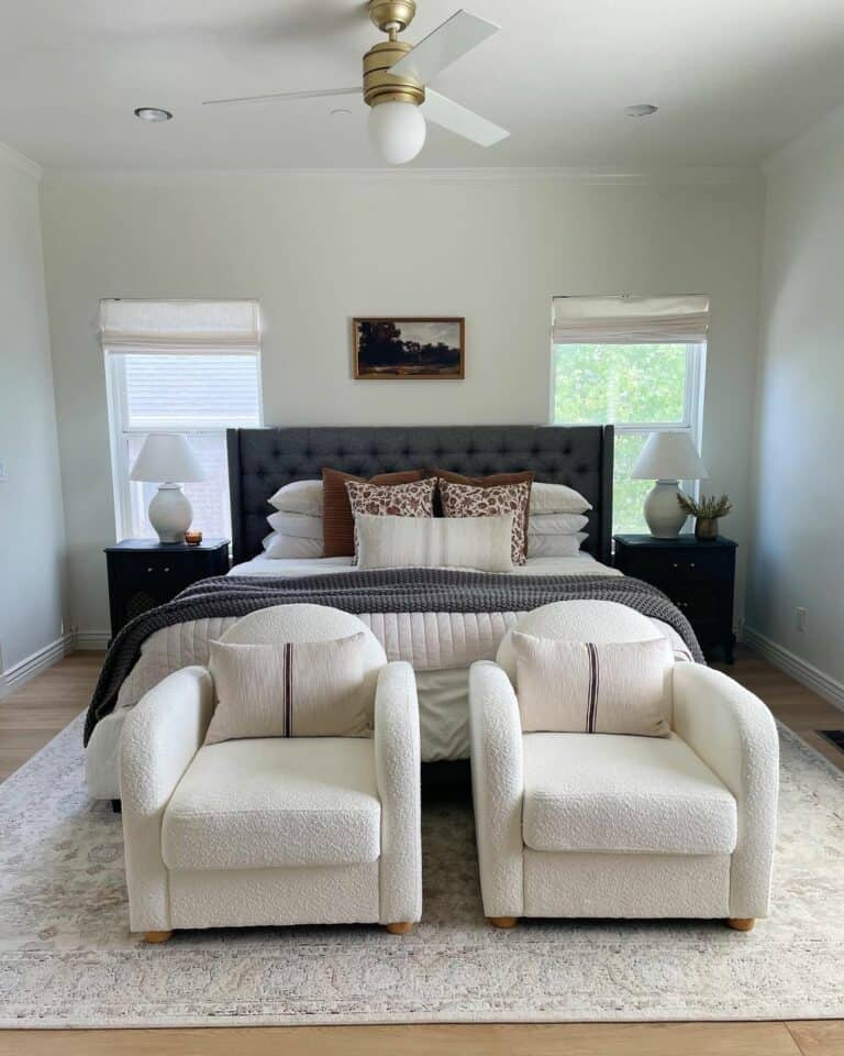 White and Gray Master Bedroom With Boucle Armchairs