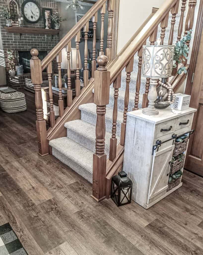 Wood Banisters and Light Gray Carpeted Stairs