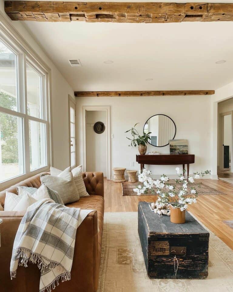 Wood Beam Living Room with Black Rustic Trunk Coffee Table