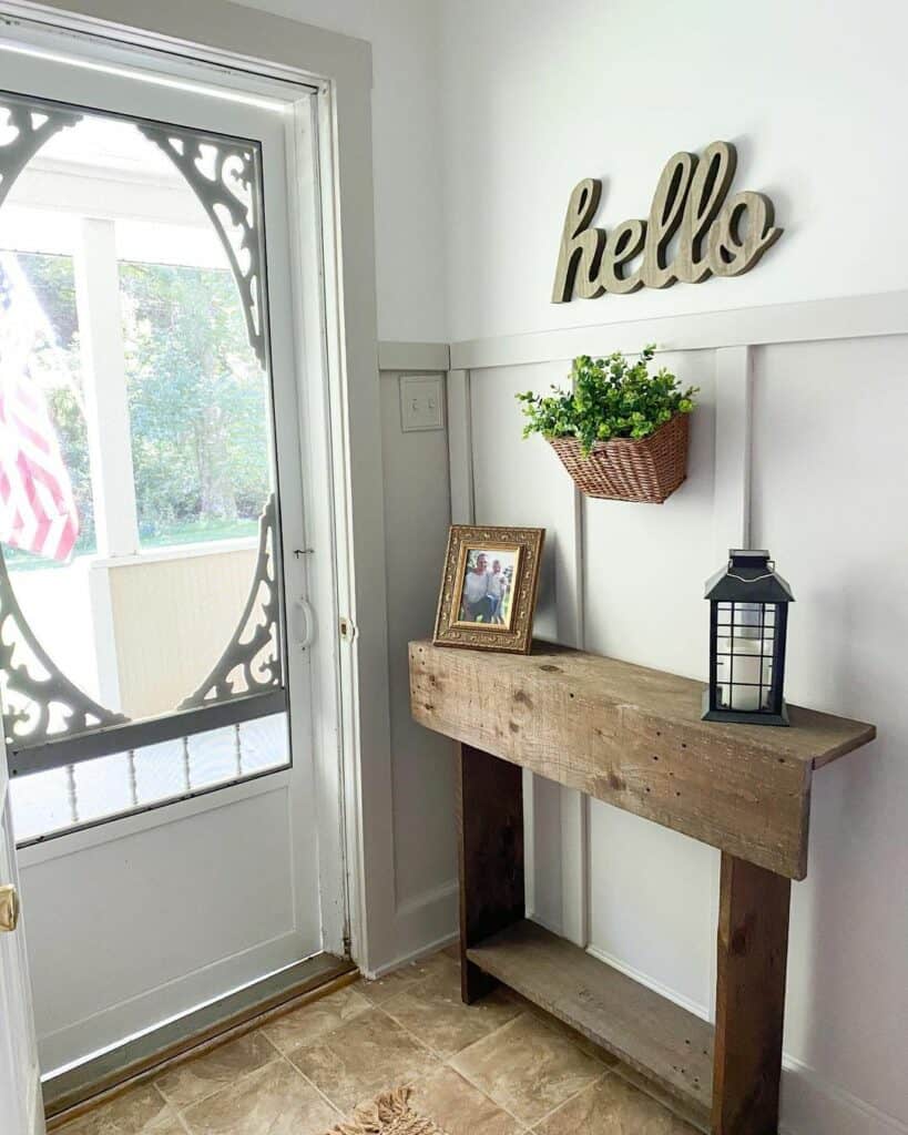 Wood Entry Table With Black Lantern Décor