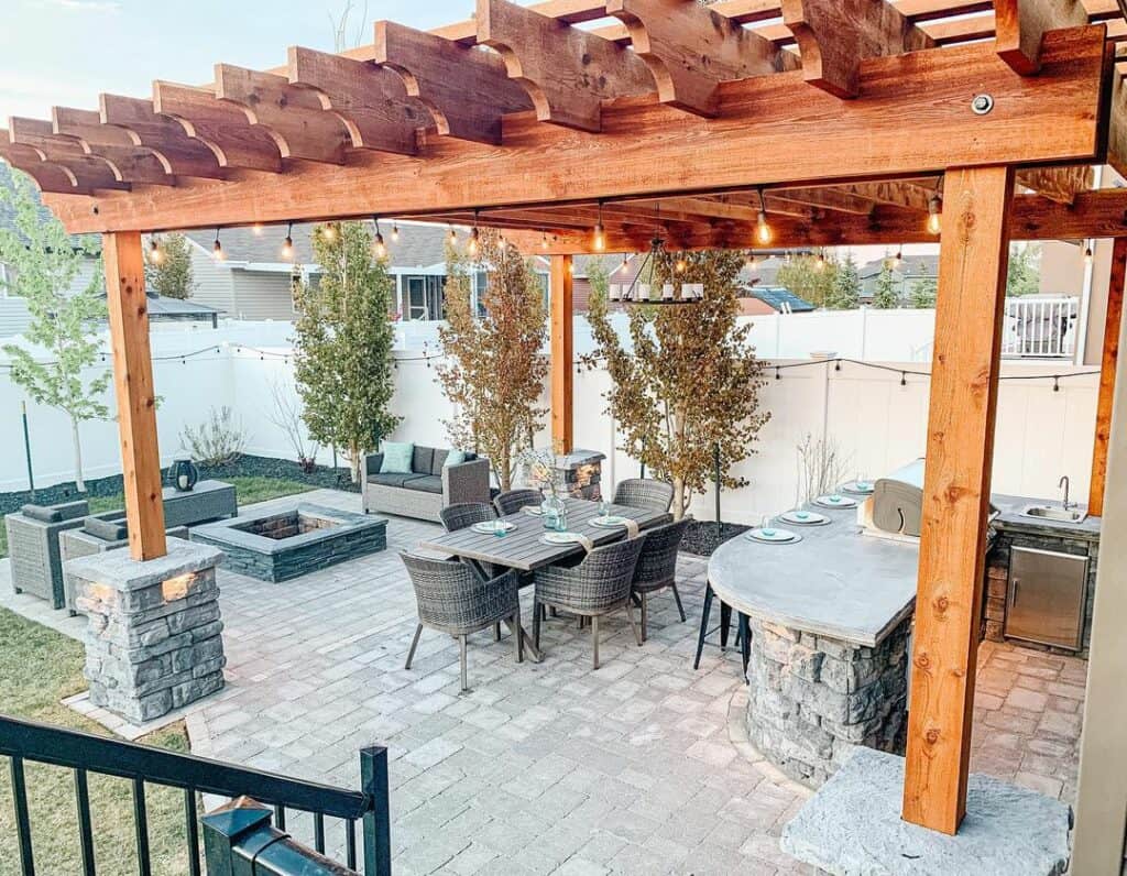 Wooden Pergola With Gray Stone Square Fire Pit