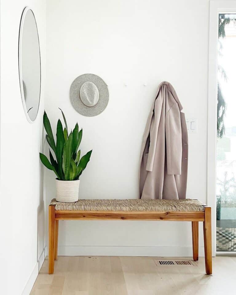 Woven Bench With Small Potted Plant